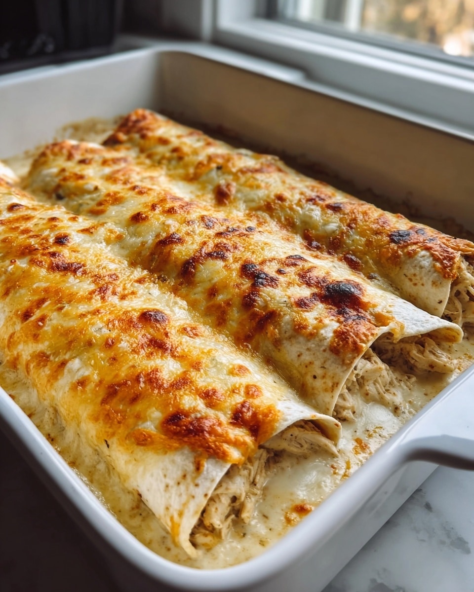 The image shows a white square baking dish with six rolled tortillas covered with melted yellow cheese on top, resting on a dark gray cloth over a white marbled surface. Next to it, there is a single unrolled white tortilla flat on the same white marbled surface, layered with shredded cheese and shredded brown cooked meat in the center. A beige cloth napkin is partially visible in the bottom right corner. Photo taken with an iphone --ar 4:5 --v 7