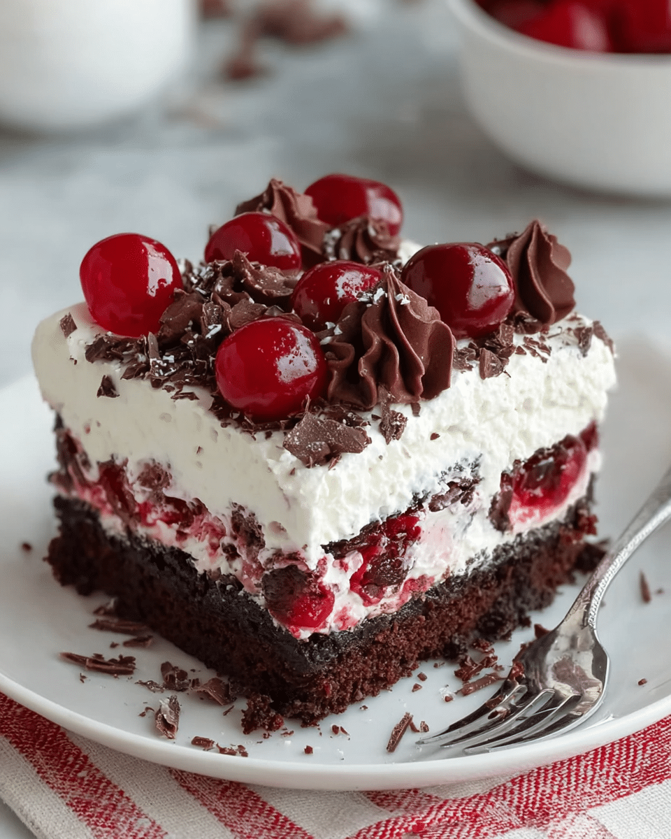 The image shows a close-up of a slice of layered dessert on a white plate placed on a white marbled surface. The bottom layer is a dark, crumbly chocolate cake. Above this is a thick, fluffy white cream layer, which is slightly uneven in texture. On top of the cream are fresh red raspberries and dollops of glossy dark chocolate sauce that drip slightly down the sides. The dark chocolate contrasts vividly with the bright red raspberries and white cream, making the dessert look rich and inviting. Photo taken with an iphone --ar 4:5 --v 7