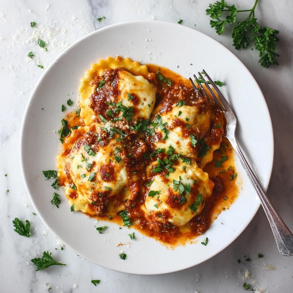 The dish shows three layers of ravioli on a white plate, covered in thick, melted golden-brown cheese with some darker browned spots. The ravioli are filled with a meat mixture that can be seen peeking out beneath the cheese layer. The sauce around the ravioli is a rich, reddish-brown color, slightly pooling on the plate. Bright green parsley is sprinkled on top for color. A silver fork rests on the right side of the plate, and the scene is set on a white marbled textured surface with some scattered parsley flakes. Photo taken with an iphone --ar 4:5 --v 7