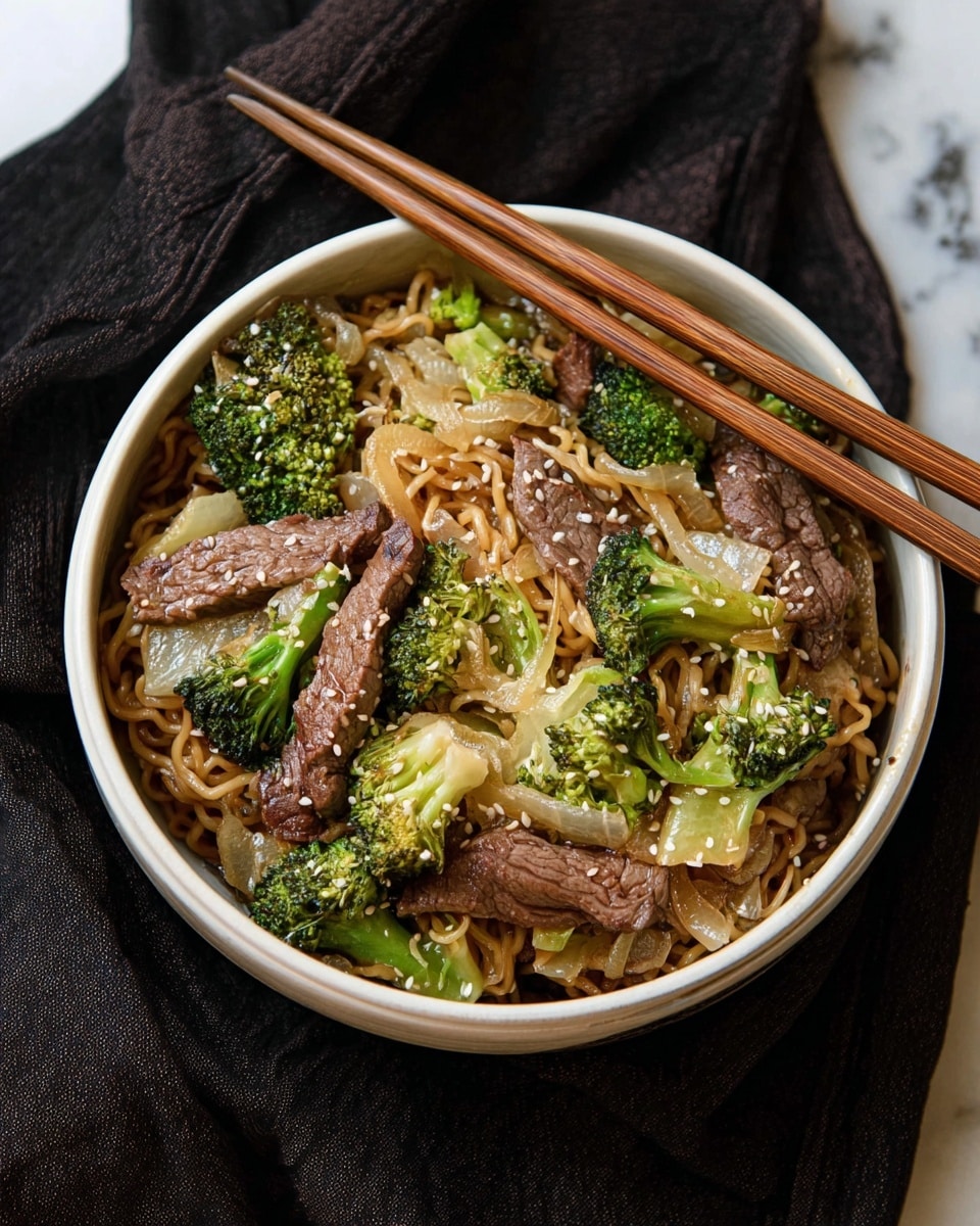 The dish shows three main layers in a shallow white bowl with chopsticks resting on top. The bottom layer is light brown, thin noodles cooked and slightly wet. The middle layer is bright green broccoli pieces and translucent white onion slices scattered evenly on top of the noodles. The top layer has several slices of cooked brown beef, laying across the noodles and vegetables. White sesame seeds are sprinkled over everything, adding small details. The background is a white marbled texture. photo taken with an iphone --ar 4:5 --v 7